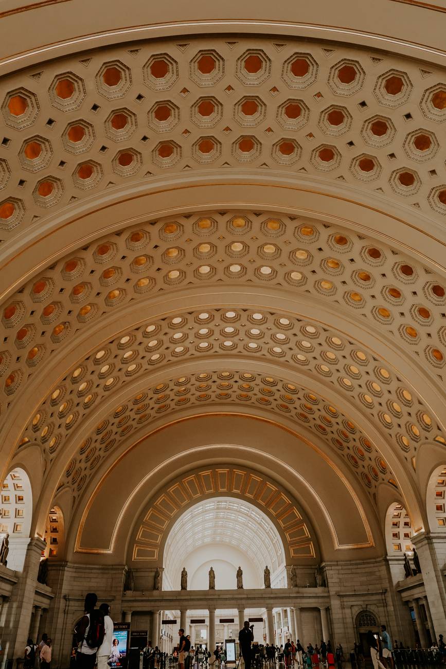 The golden coffered arches of Union Station's ceiling in Washington