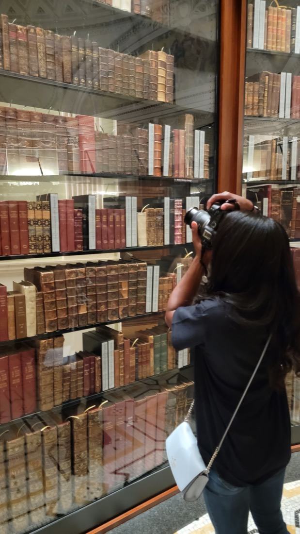 Danielle photographing Thomas Jefferson's library through the glass at the Library of Congress
