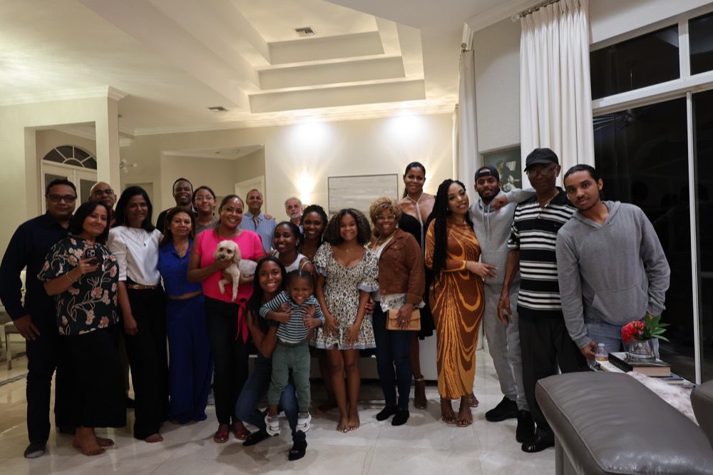 Danielle's extended family gathered together in a bright living room