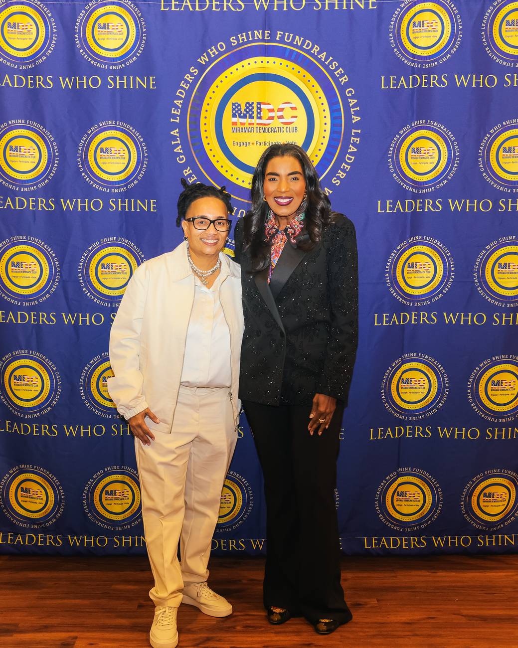 Miramar Democratic Club President Donna Hinds and State Senator Barbara Sharief on the Leaders Who Shine step-and-repeat