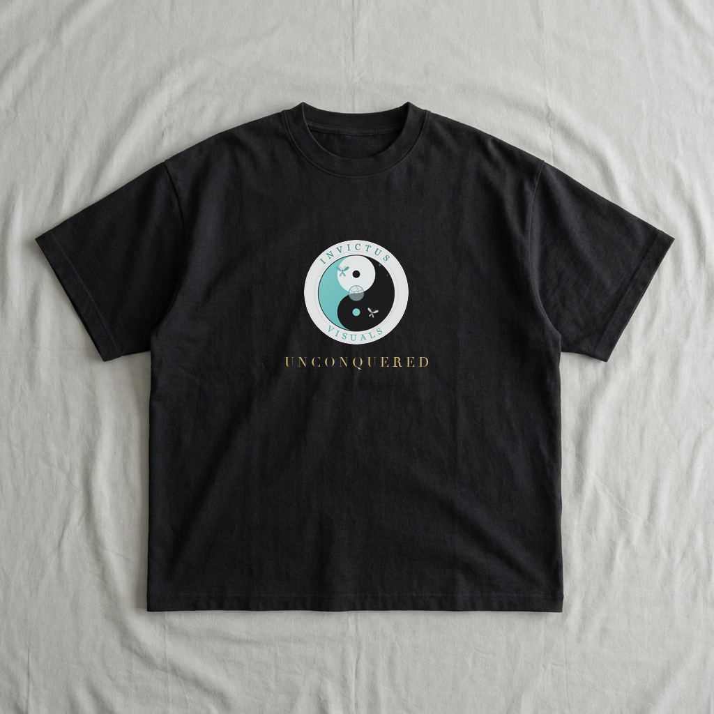 Black oversized tee mockup with the Invictus Visuals emblem and UNCONQUERED in gold across the chest