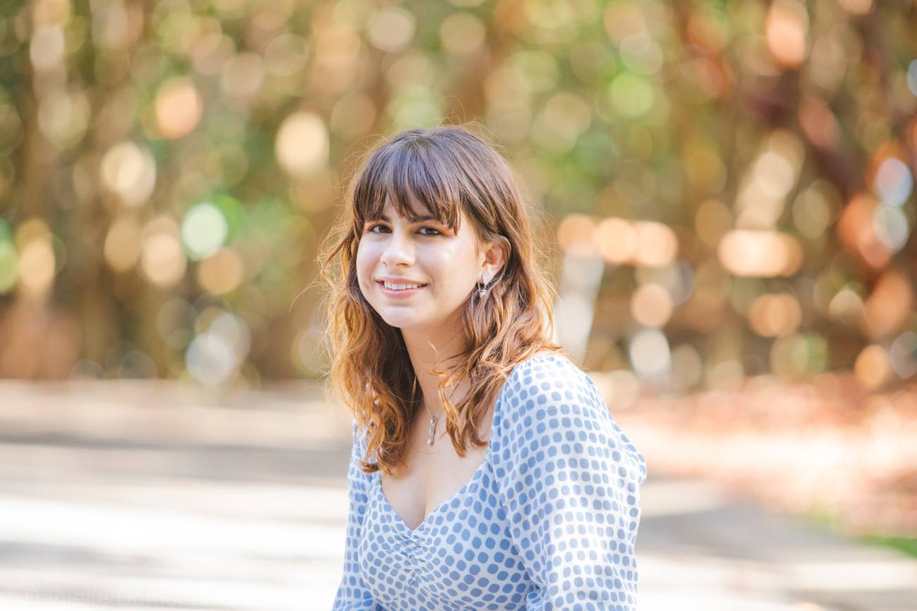 Portrait of Annalise smiling in soft golden light