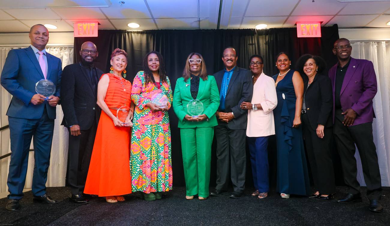 Award recipients gathered on stage at the gala